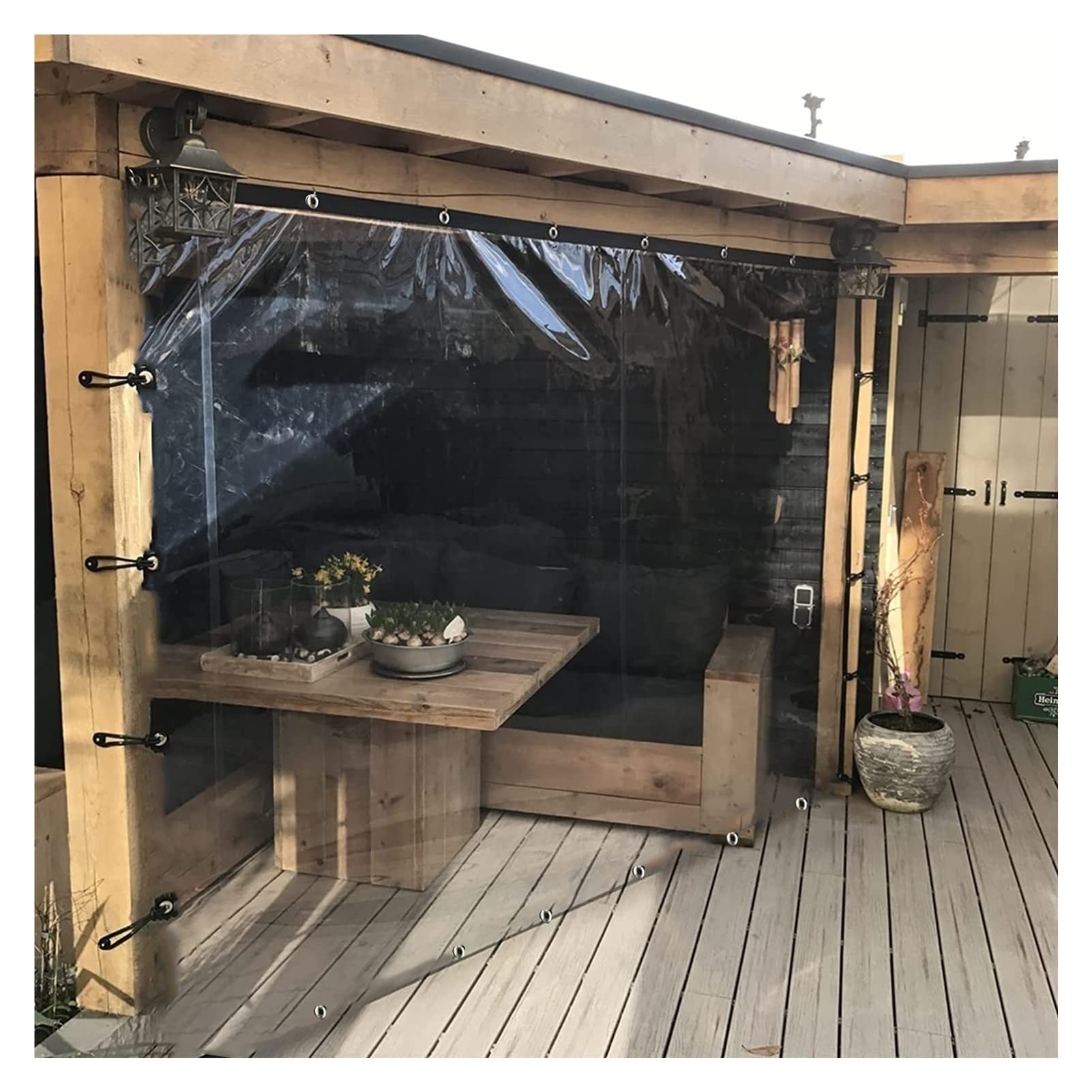 Bâche transparente avec oeillets pour bloquer la pluie sous la pergola sans perdre la lumière