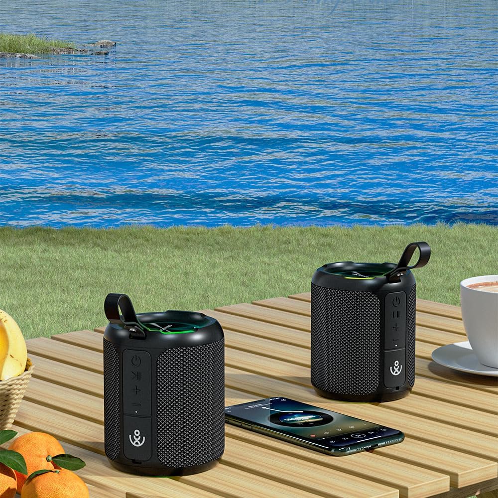 Two xdobo SINOBAND 3 Kingdoms speakers paired together on a wooden table with a smartphone.