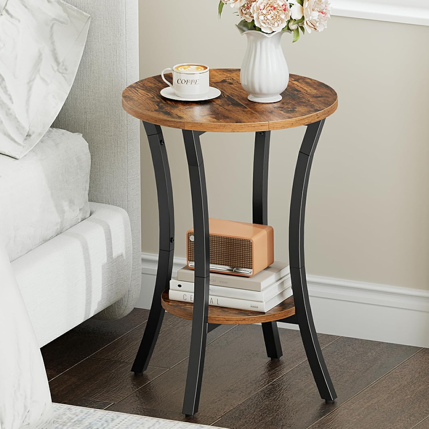 HOOBRO Round Side Table used as a nightstand in a bedroom, holding a coffee cup and a vase of flowers.