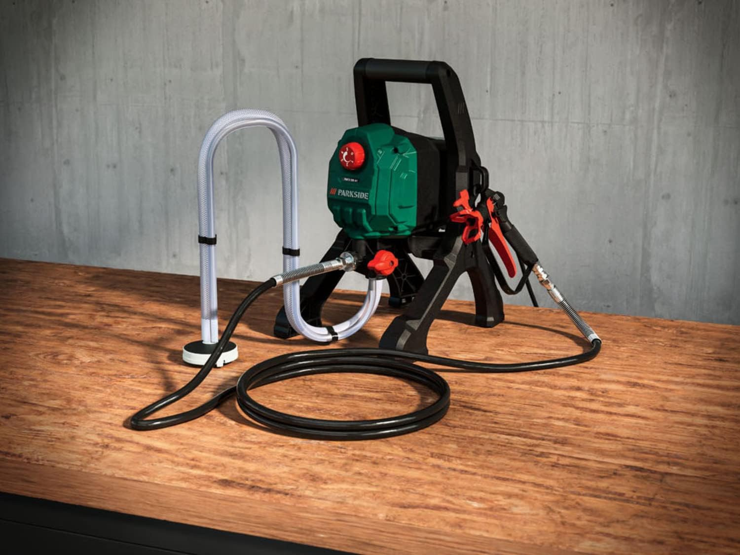 PARKSIDE Airless Paint Spray Gun set up on a wooden surface