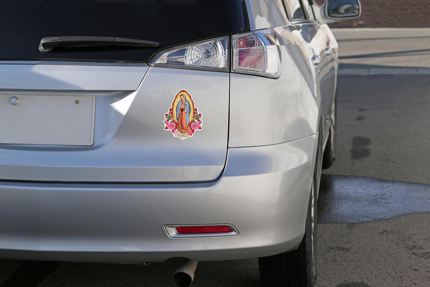 A beautiful Virgin Mary decal on a laptop