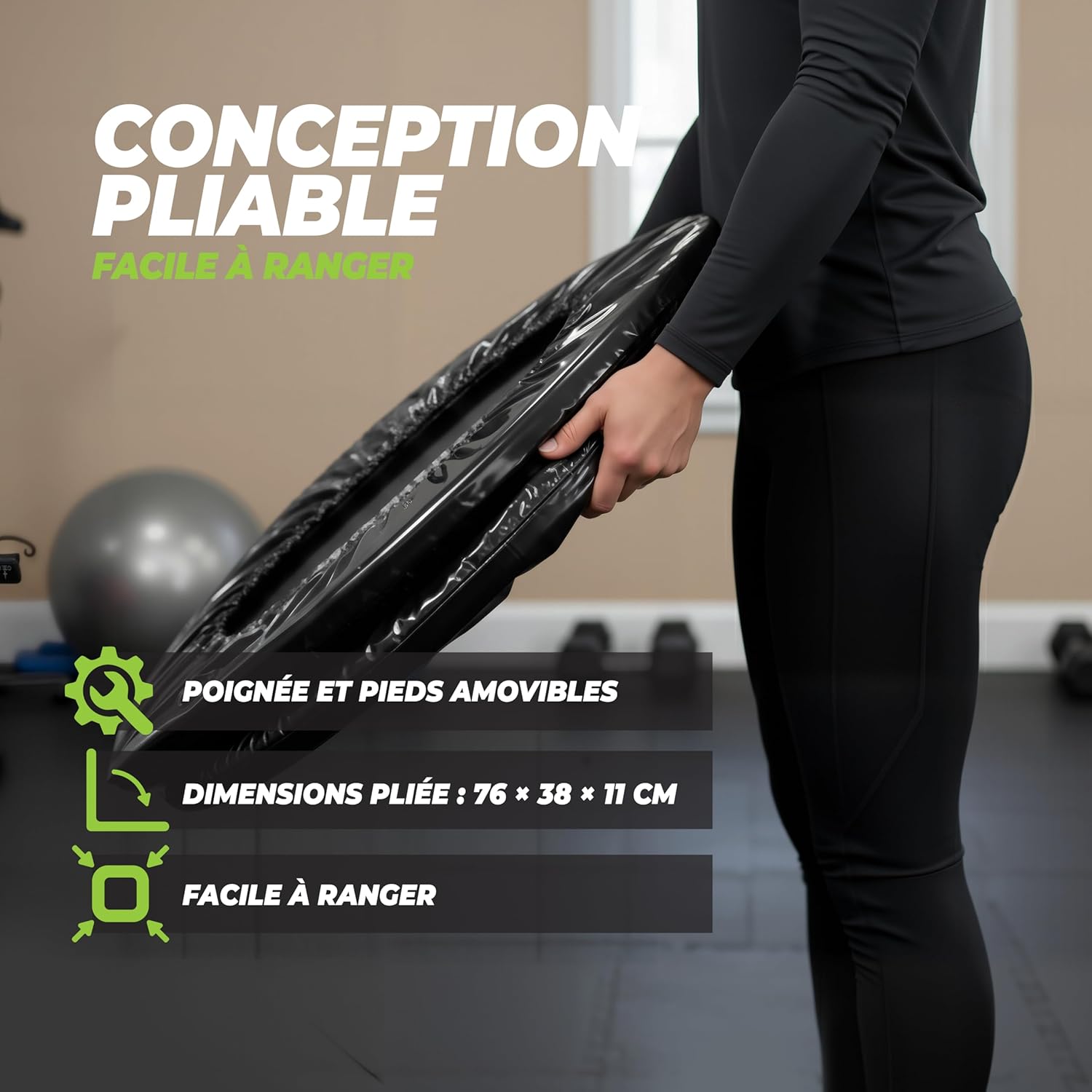 Person holding a folded VirtuFit Fitness Trampoline