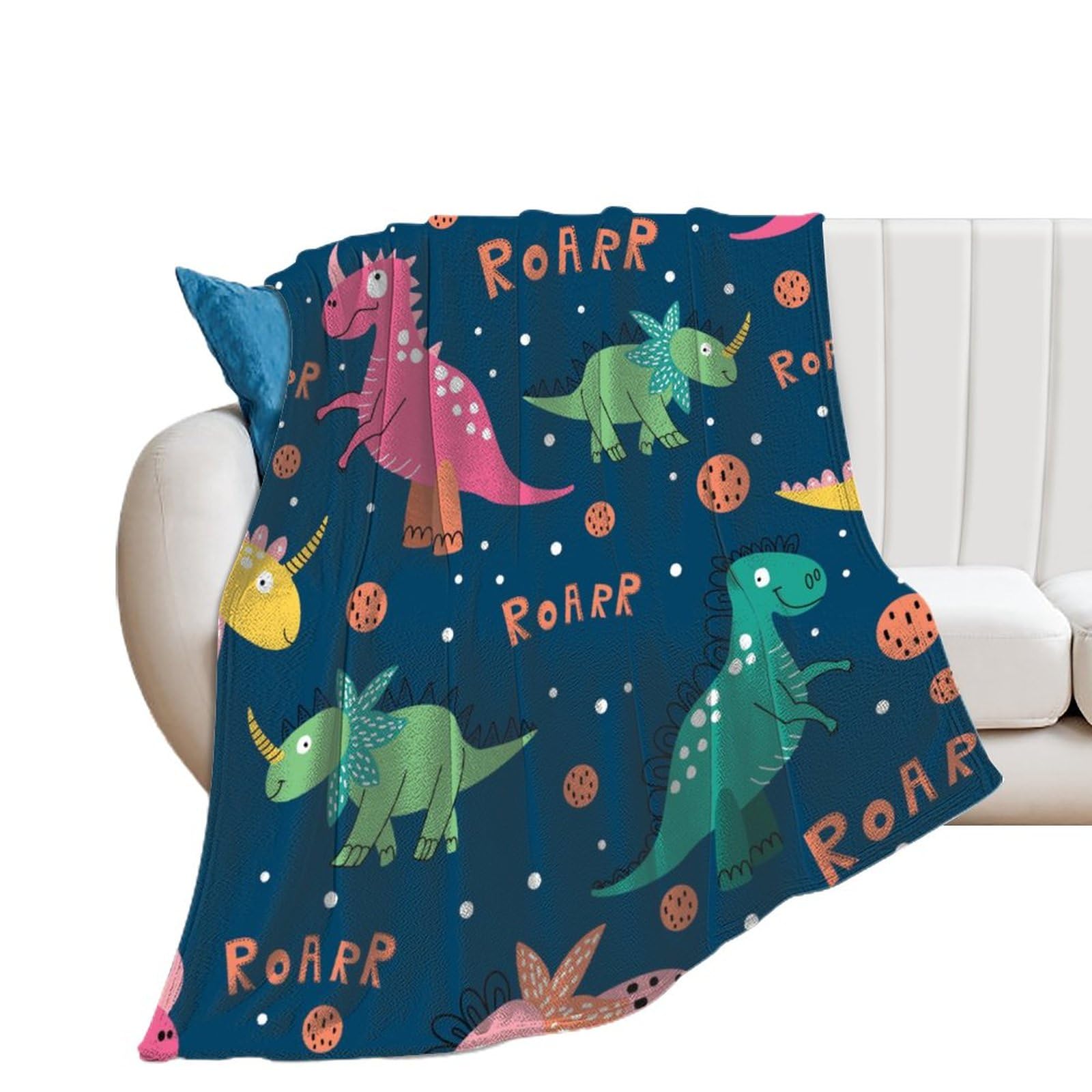 Couverture dinosaures colorés pour moments cocooning sur le canapé du salon