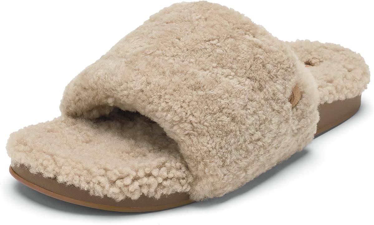 OluKai Women's Kipe'a Ulana Shearling Slide Slippers with Arch Support | Embroidered logo, suede label and patterned Wet Grip Rubber add crafted detail from quiet mornings to quick outdoor steps.