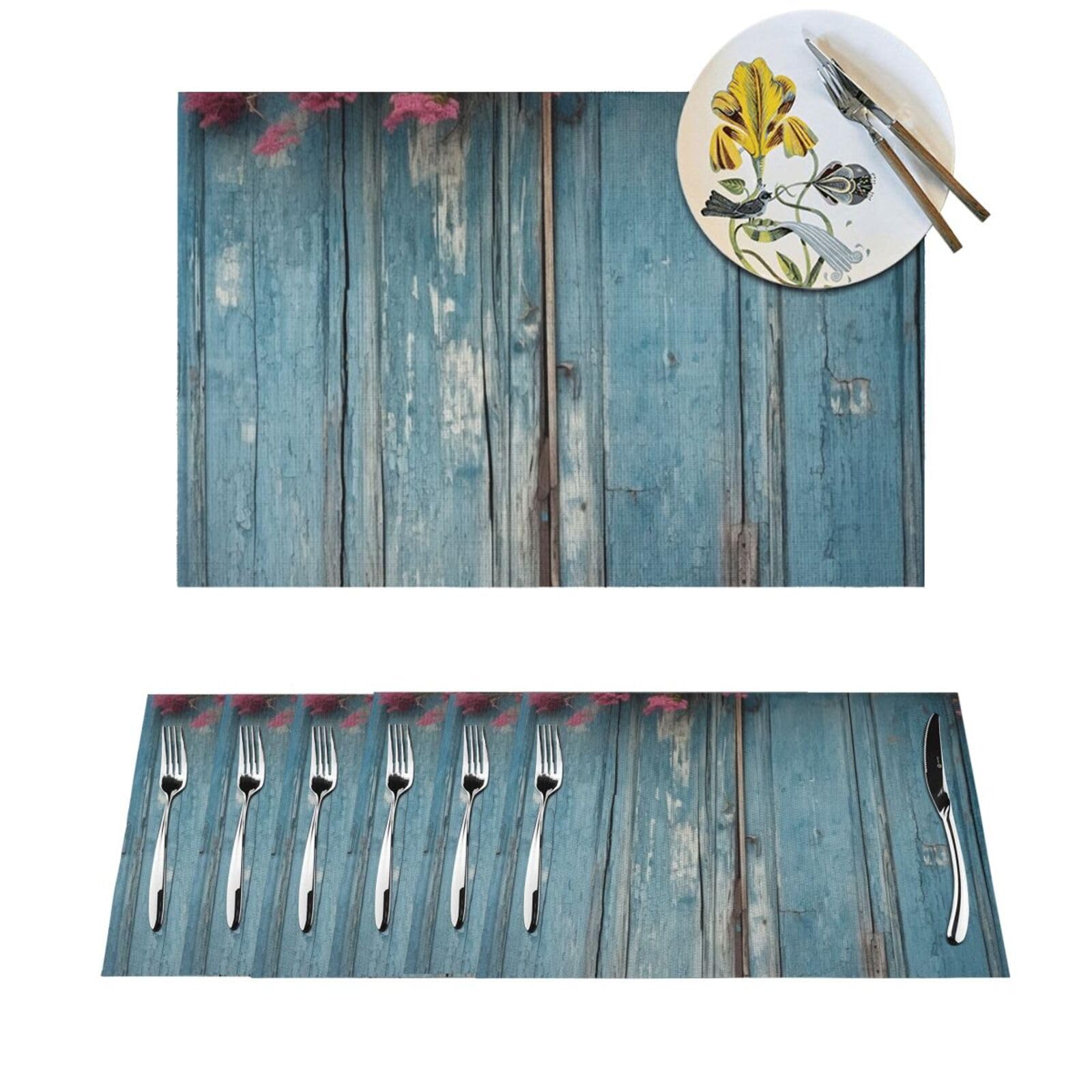 Sets de table tissés en PVC bleu effet bois pour décorer votre table de jardin