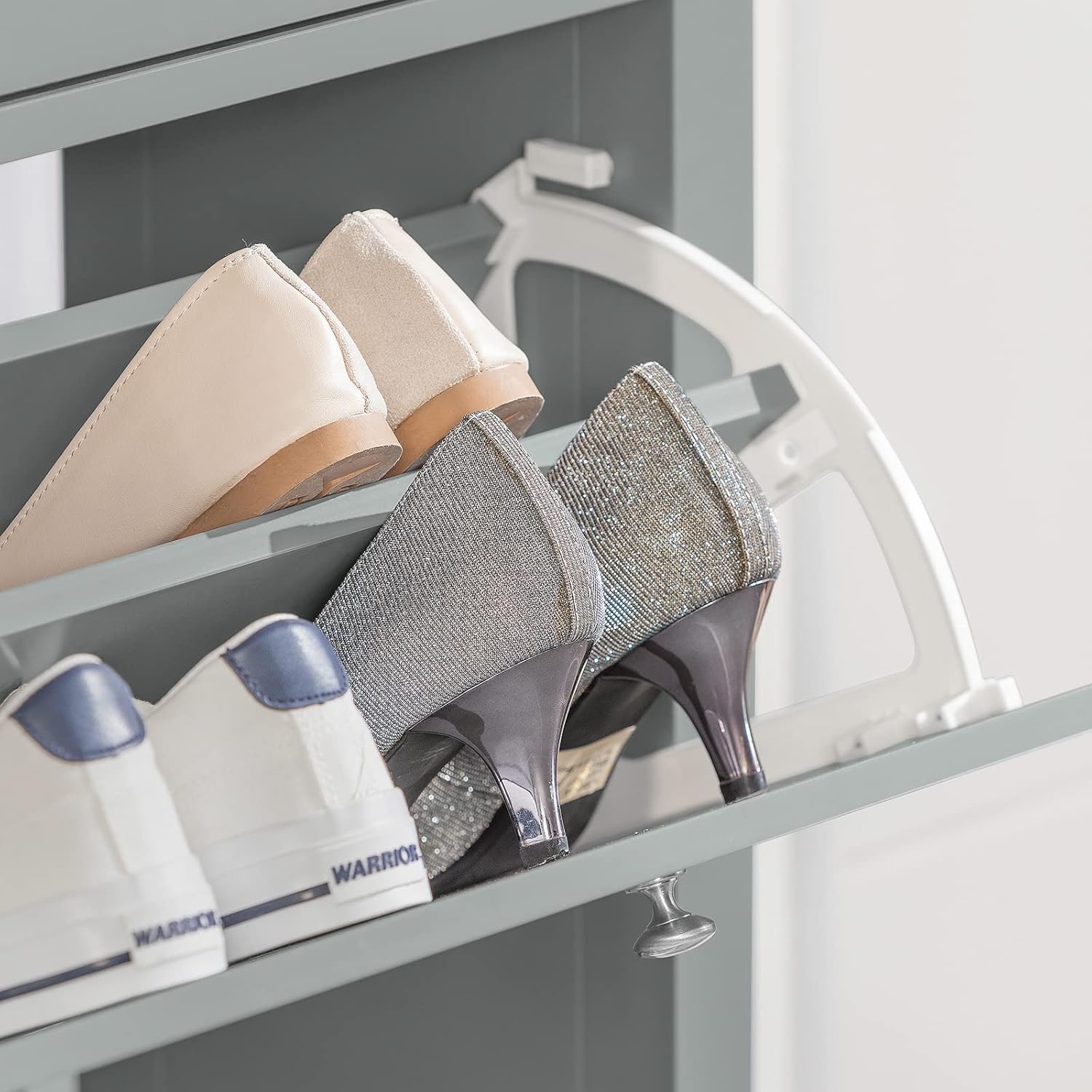Close-up of shoes stored in a flip-drawer of the SoBuy Shoe Cabinet