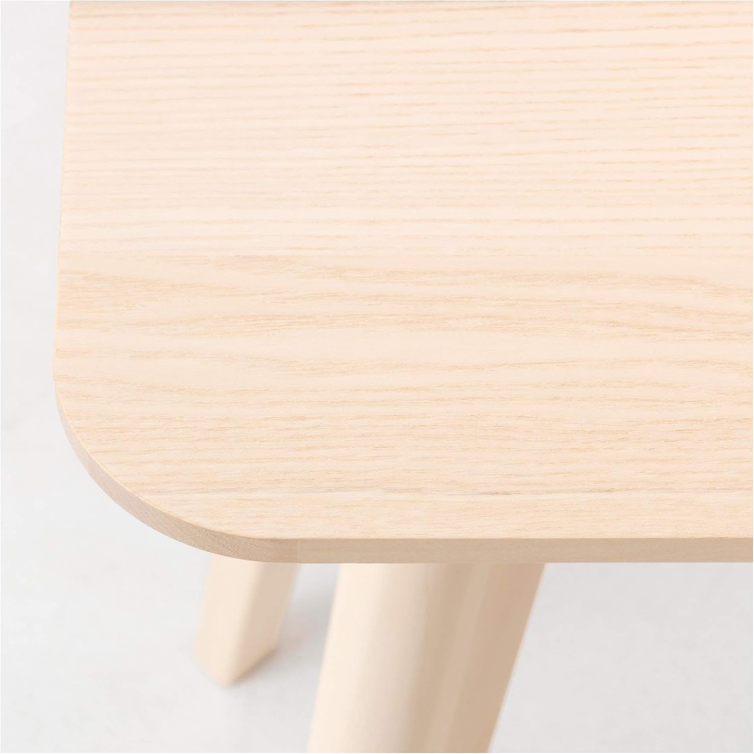 Close-up of the smooth ash veneer surface of the LISABO desk.