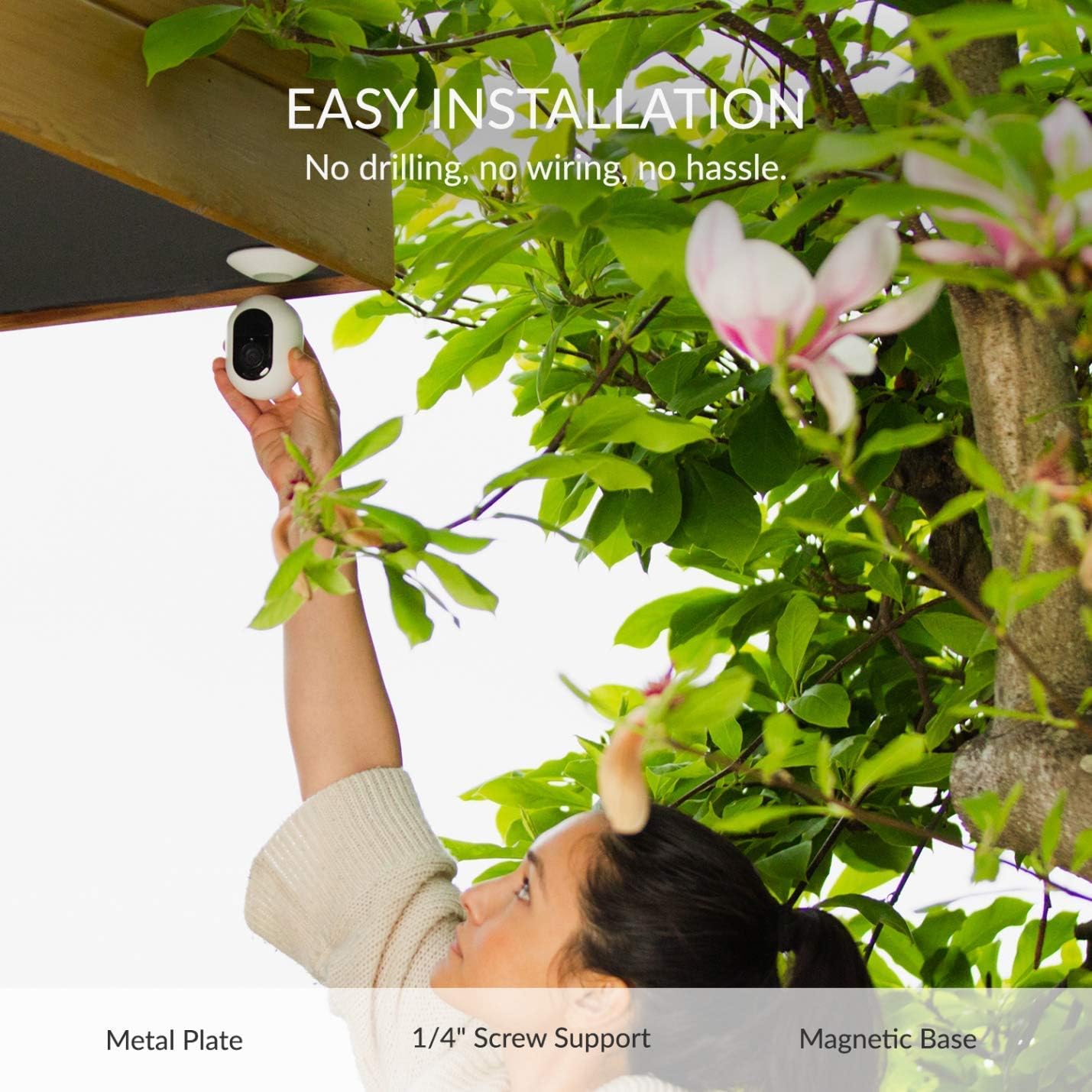 Person installing Kami camera under eaves