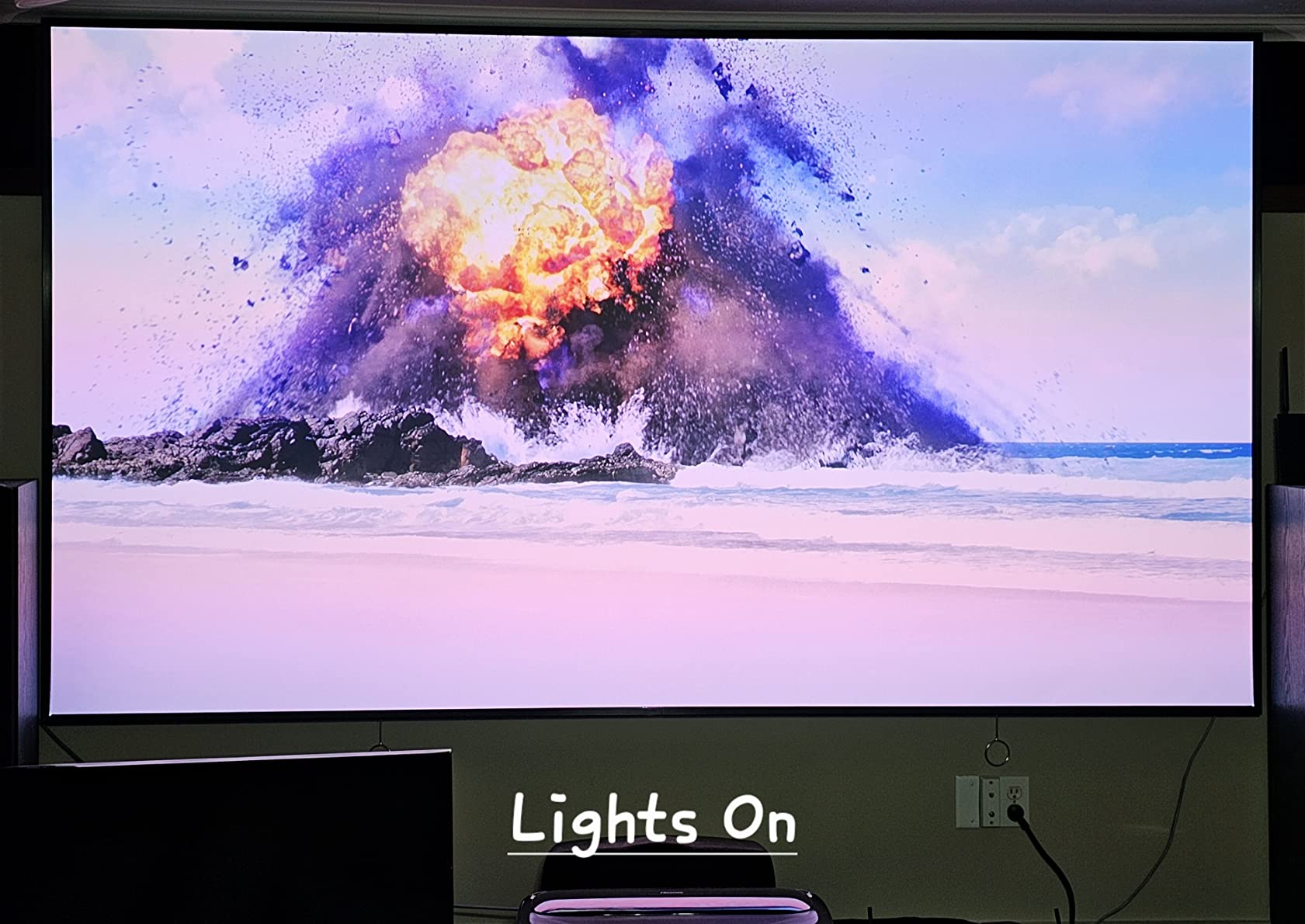 Hisense Laser TV ultra short throw projector and ambient light rejecting screen setup in a living room