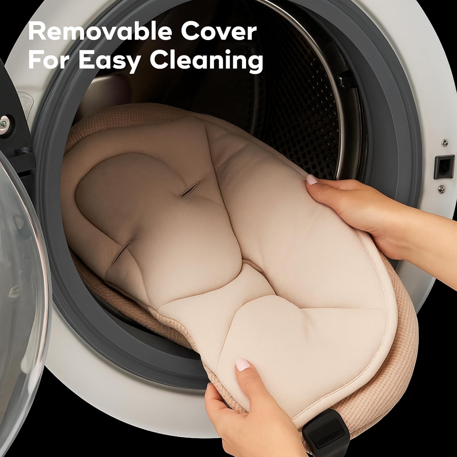 A hand placing the removable seat cover of the Babymoov Swoon Evolution into a washing machine.
