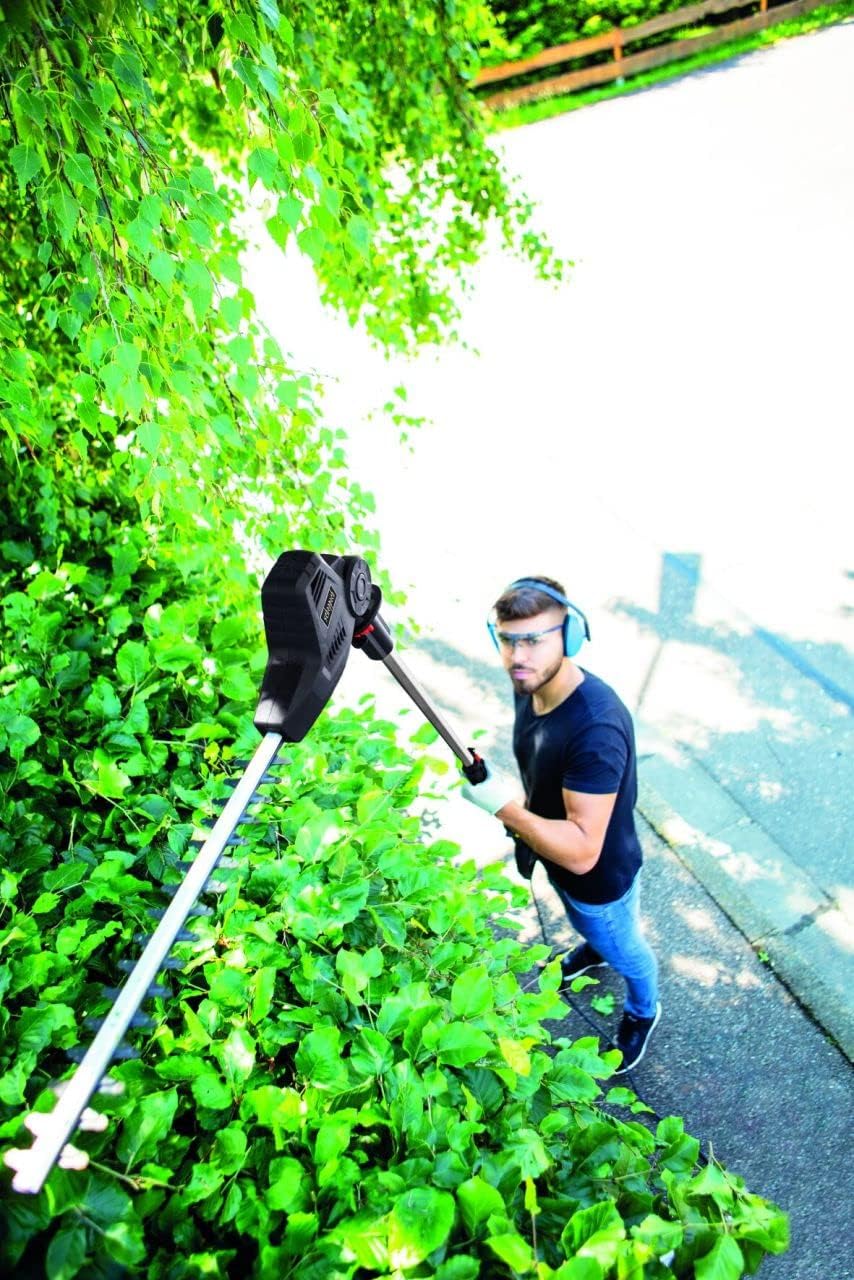 User operating Scheppach TPX710 hedge trimmer with extended pole for high hedges