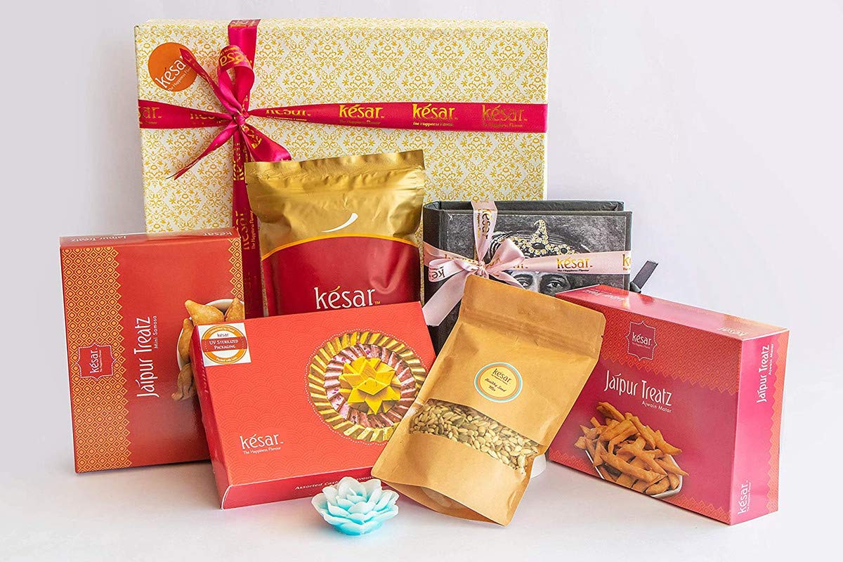 Dessert Drama by Kesar Sweets | Sweets & Snacks Gifts - Samosa, Ajwain Mathri, Namkeen (250g each), Mix Seeds (150 g), Chocolate (12 pc), Flavoured Kaju Katli (400 g) + Candle | Chocolates Gift Hamper for Friends & Family | Corporate Gifts for Staff-image-24