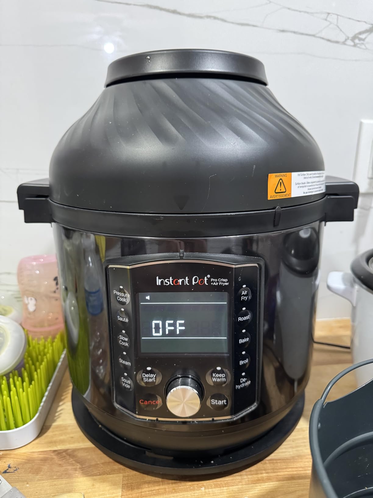 Instant Pot Duo Crisp accessories laid out including both lids, basket, and rack