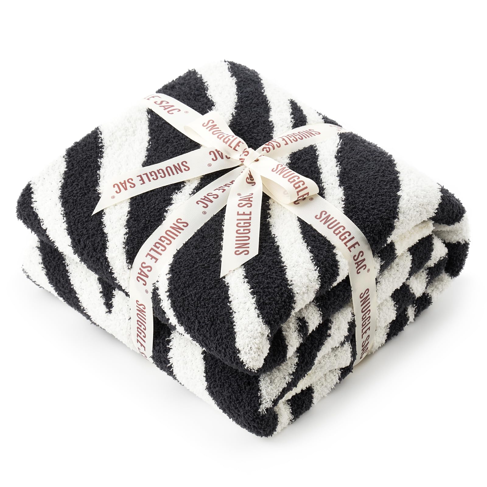 Couverture réversible douce zèbre pour cocooning thermique sur sofa et fauteuil
