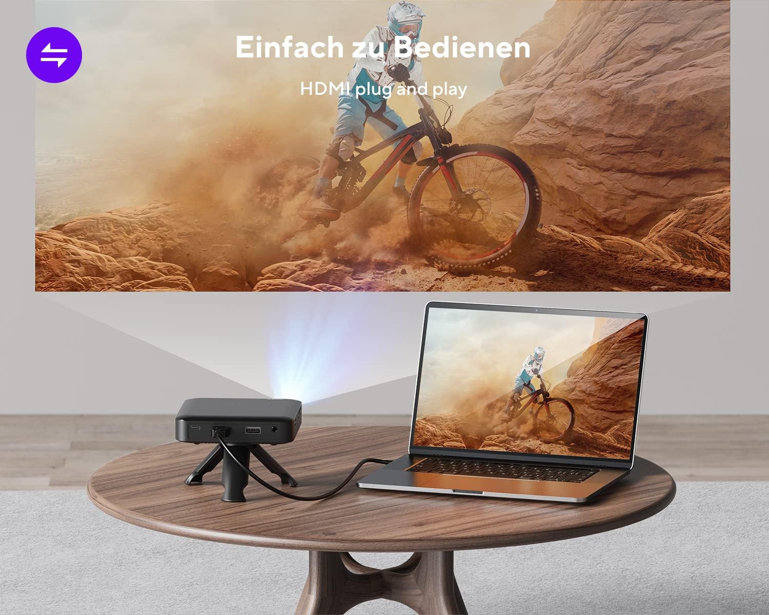 The AKIYO Z9 Mini DLP Projector connected via USB cable to a smartphone, charging the phone.