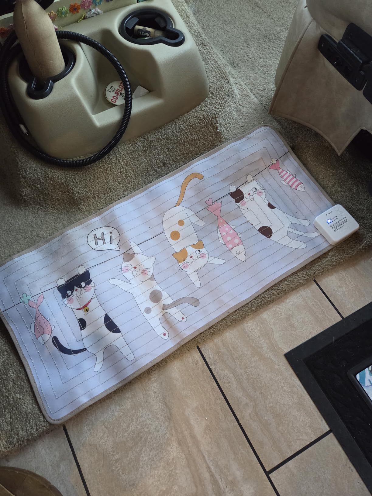 Person using a test pen on the pet shock mat to verify functionality