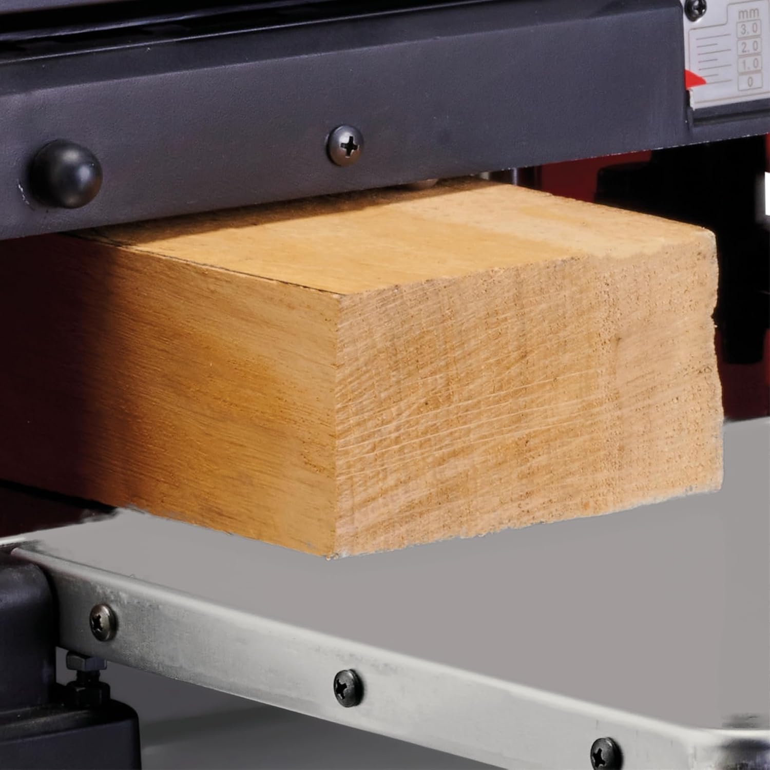 Close-up of wood being planed by the Einhell TE-SP 330.