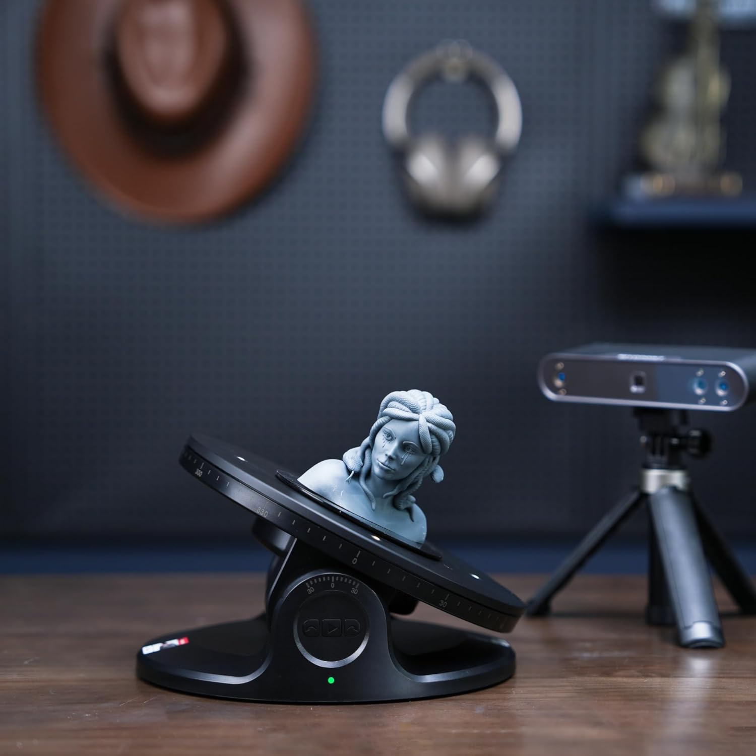 Revopoint Dual Axis Turntable tilted with a small object on its surface, ready for scanning