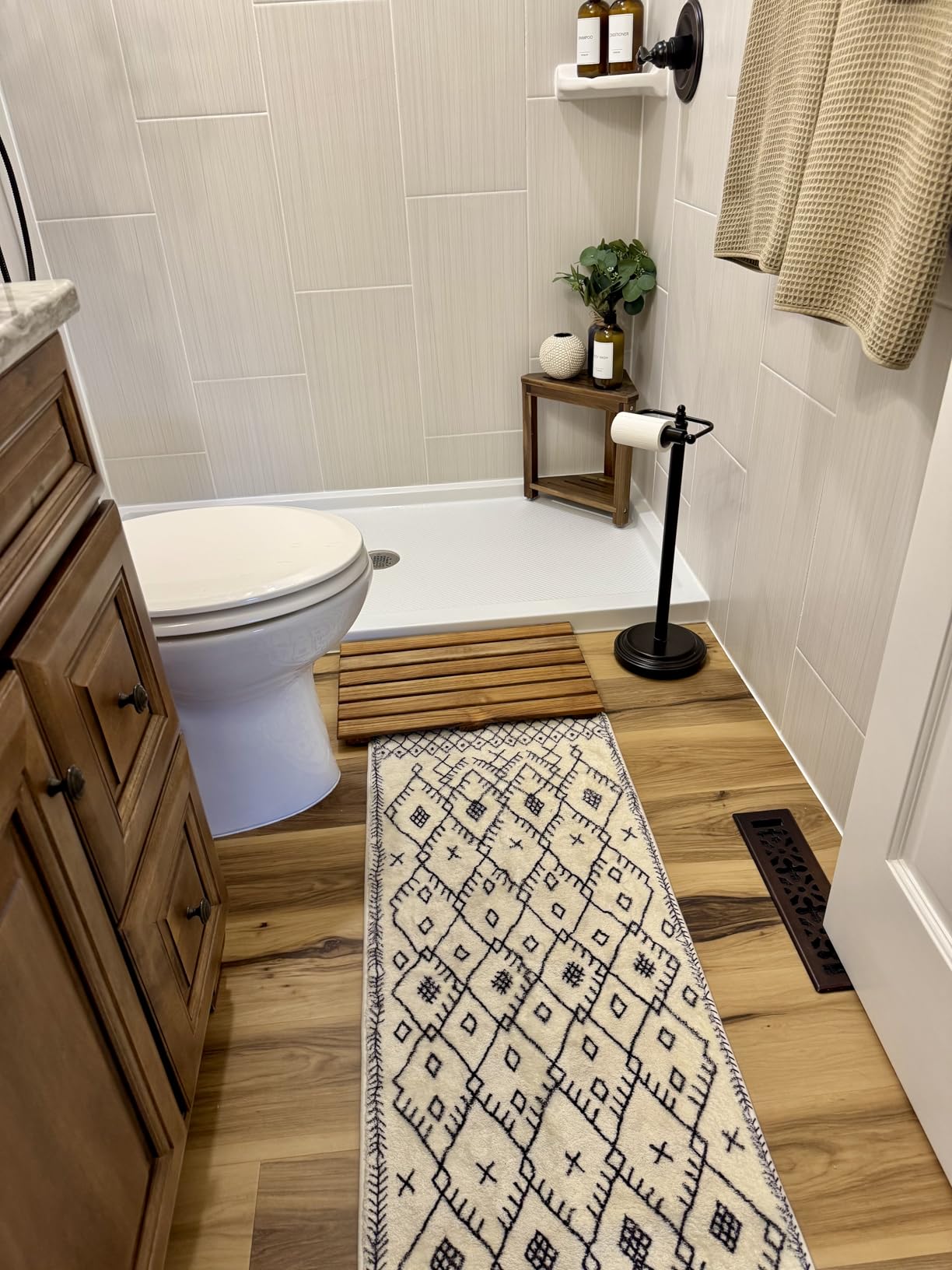 Wooden bath mat styled spa-like bathroom example