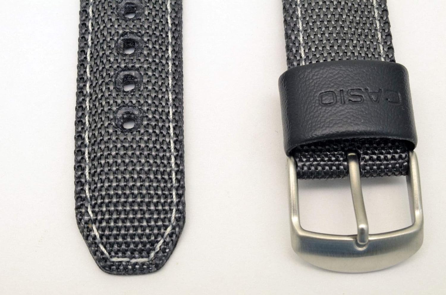 Close-up of the Casio watch band buckle and strap texture.