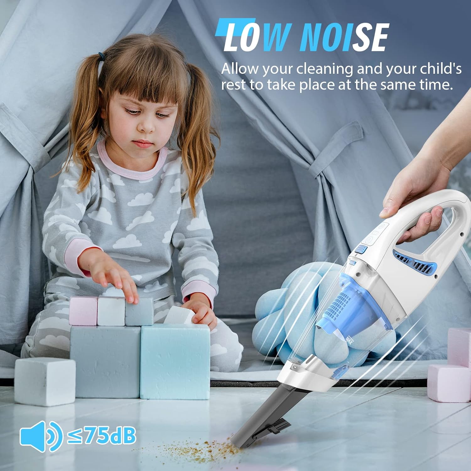 Child playing while handheld vacuum is used nearby, illustrating low noise operation