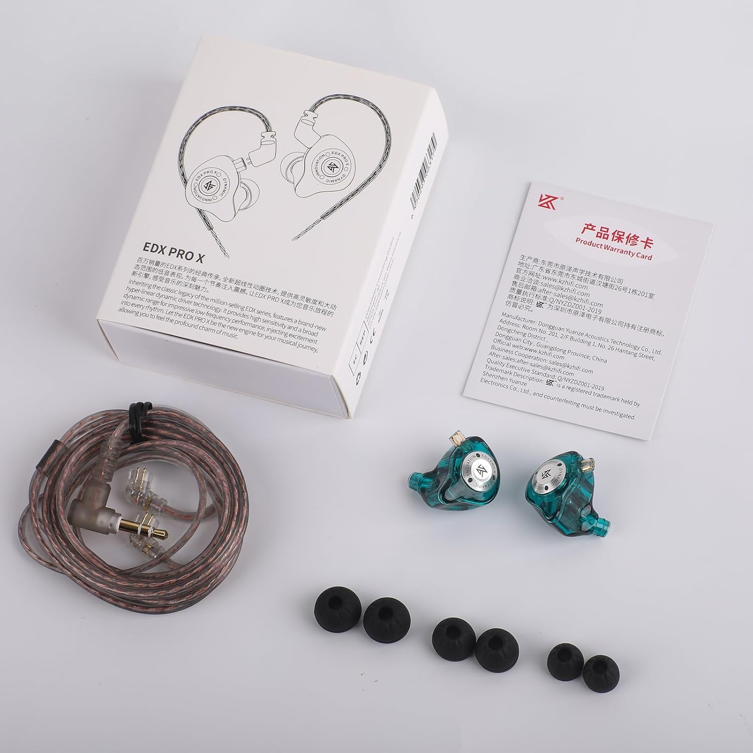 Contents of the KZ EDX Pro X earphone box, including earphones, cable, ear tips, and user manual.