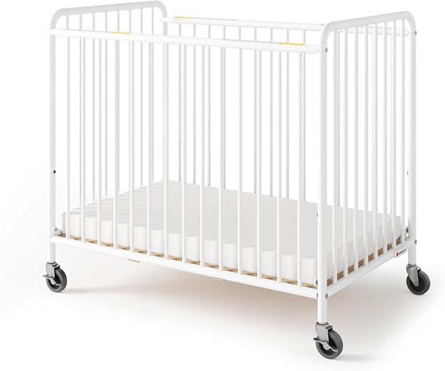 Foundations Chelsea Slatted Metal Compact Daycare Crib, 3" Casters, Compact Mini Size, Easy to Clean Durable Finish, Adjustable to Two Heights Mattress Board, White