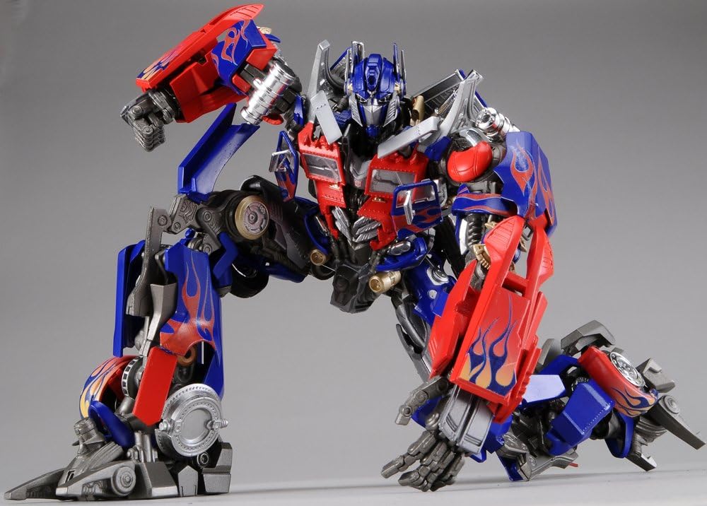 Optimus Prime model kneeling on one knee, ready for action.