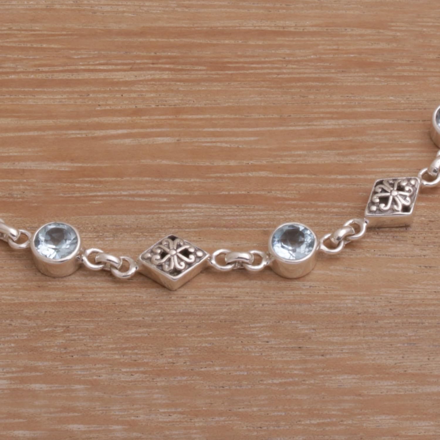 NOVICA Artisan Blue Topaz Link Bracelet and Sterling Silver from Bali Indonesia Birthstone [7.75 in min L x 8.25 in max L x 1.6 in W] ' Sky Serenade'