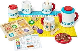 A collection of Melissa & Doug miniature kitchen accessories including pots, pans, and food items.