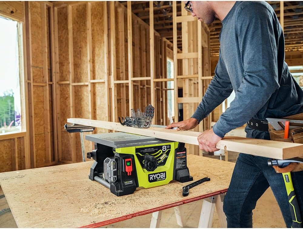 User operating the RYOBI 18V ONE+ HP Brushless 8-1/4 inch Table Saw to cut wood