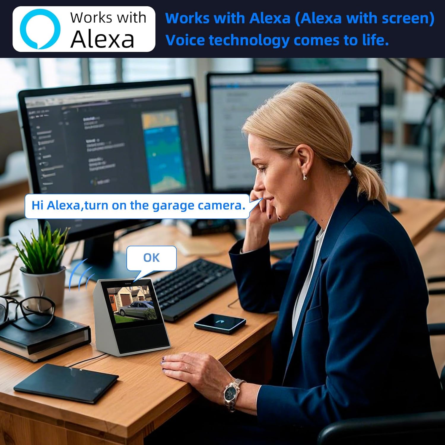 A woman at a desk interacting with an Alexa device, which displays the camera's live feed, demonstrating voice control integration.