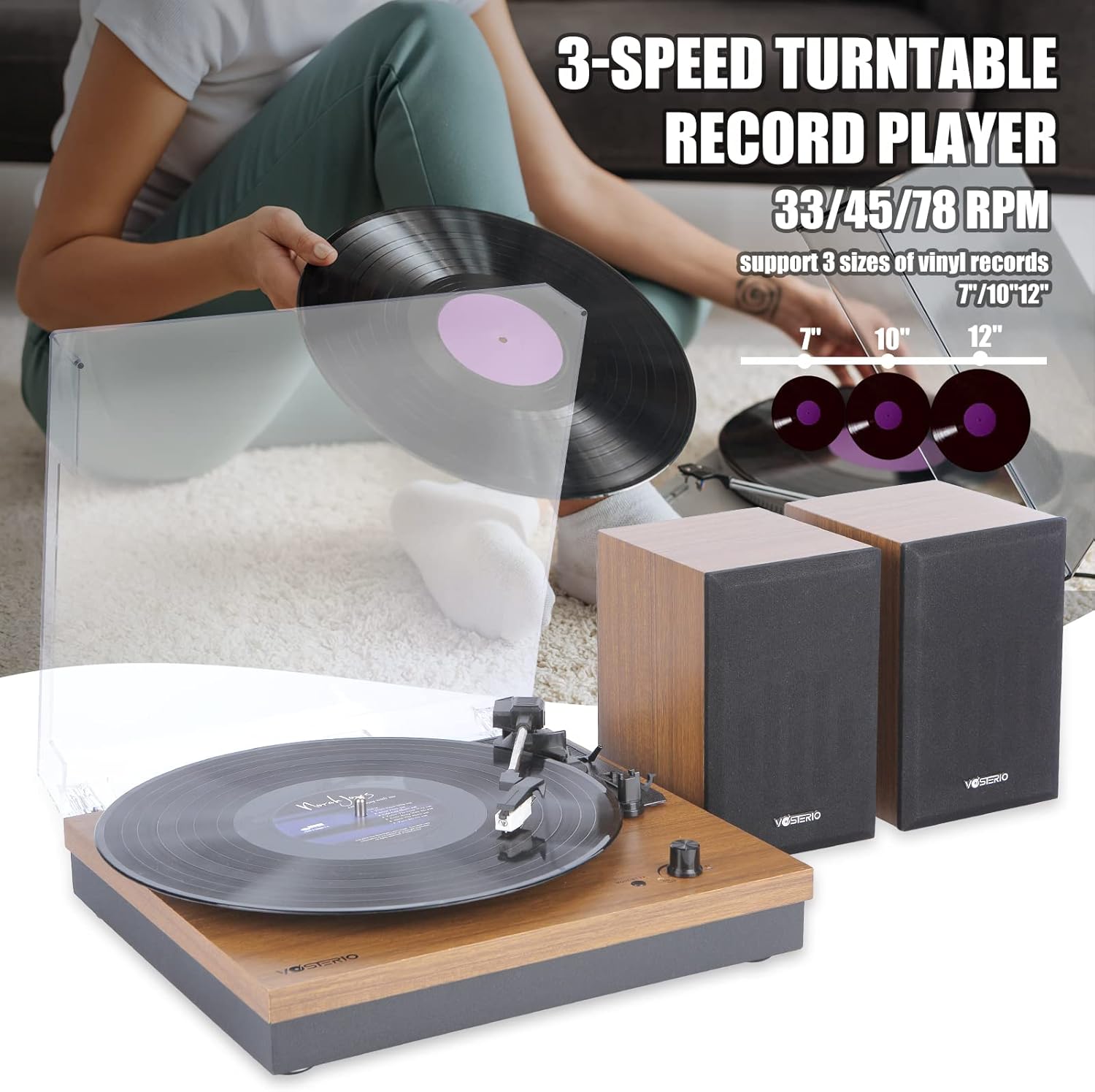A vinyl record playing on the turntable, illustrating the 3-speed capability for 7, 10, and 12-inch records