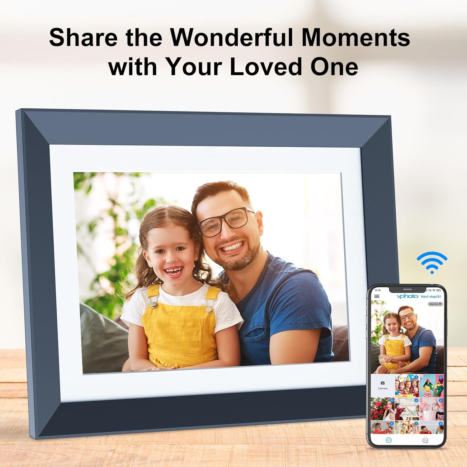 Digital picture frame displaying a photo, with a smartphone next to it showing the VPhoto app interface