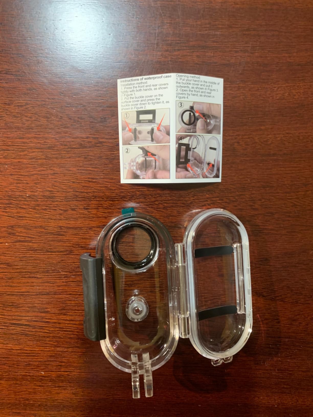 Winnes Mini Body Cam inside its transparent waterproof housing.
