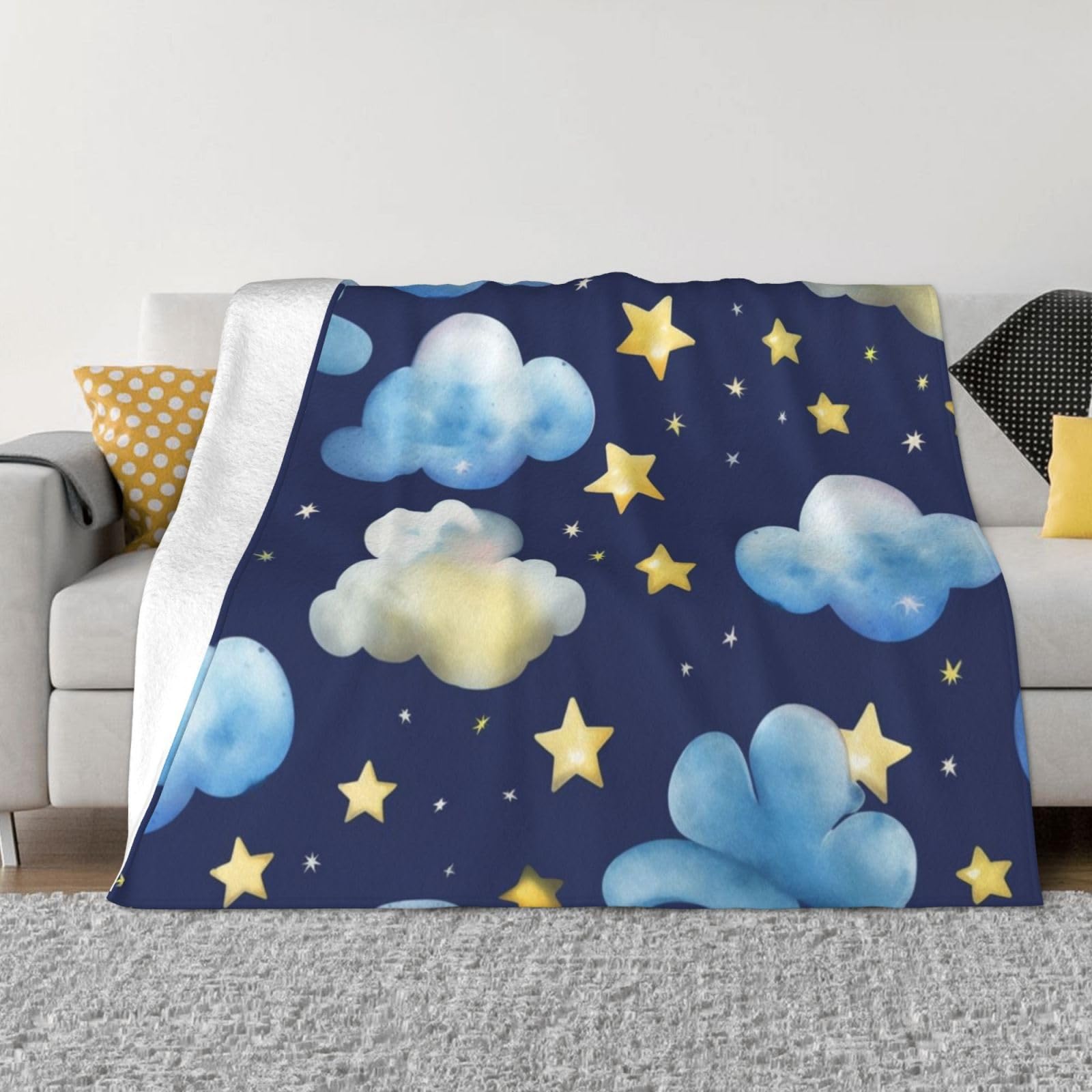 Couverture polaire douce pour soirées cocooning sur le canapé au motif étoiles