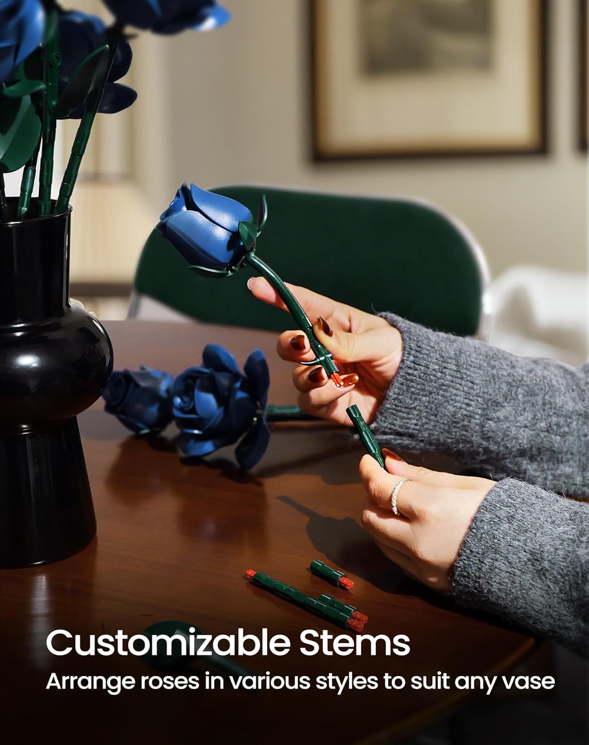 Hands assembling a customizable stem for an iATOM blue rose
