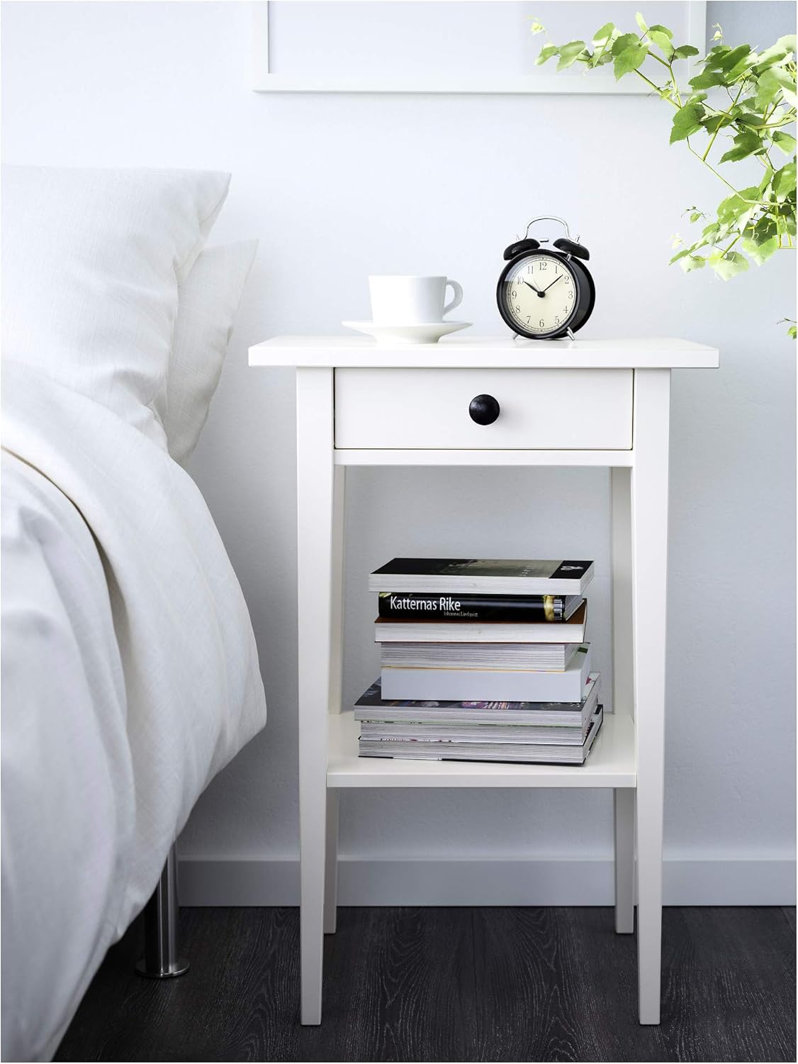 HEMNES bedside table in a bedroom setting with books on the shelf