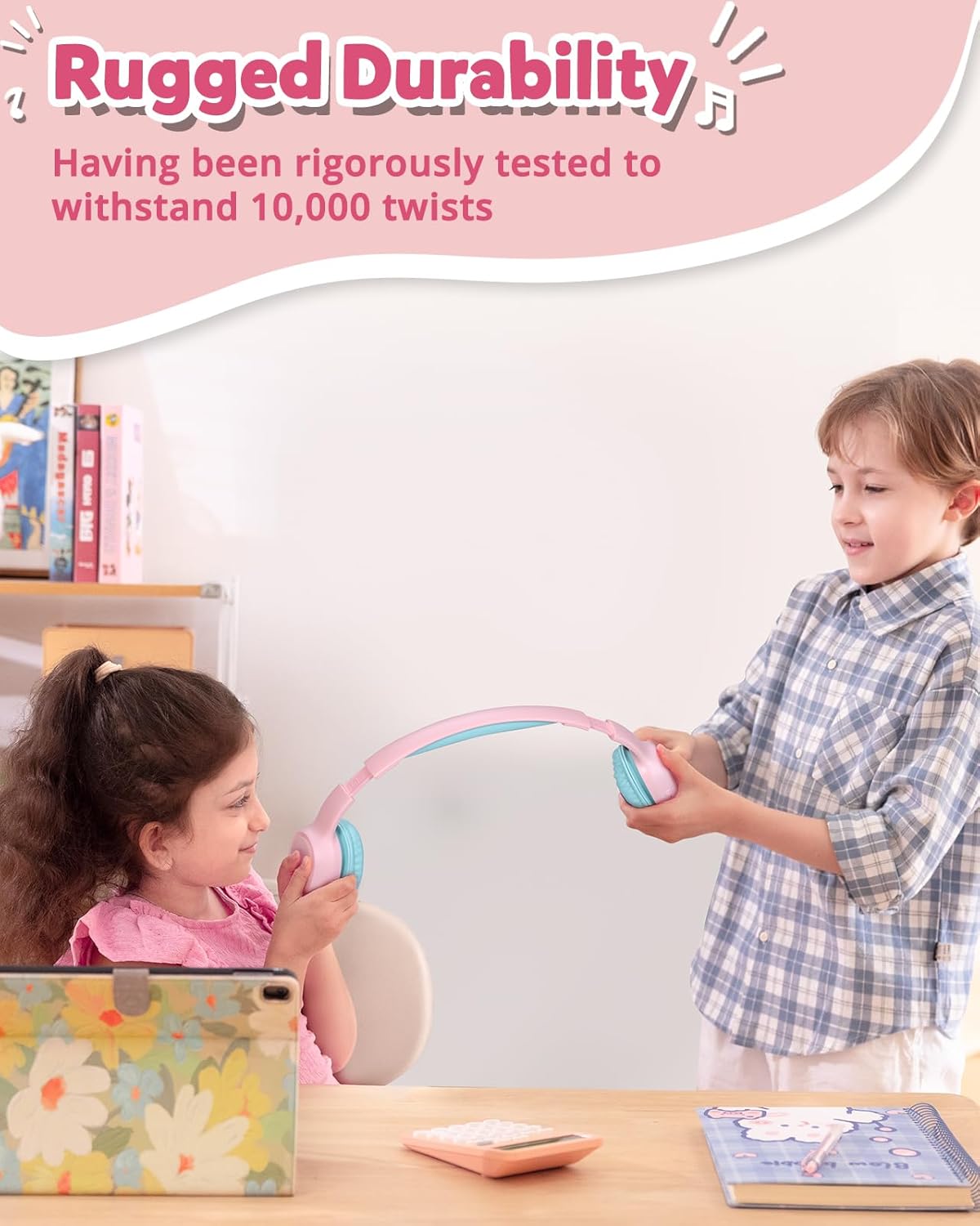 Two children demonstrating the rugged durability and twistable headband of the Tronsmart KH02 headphones.