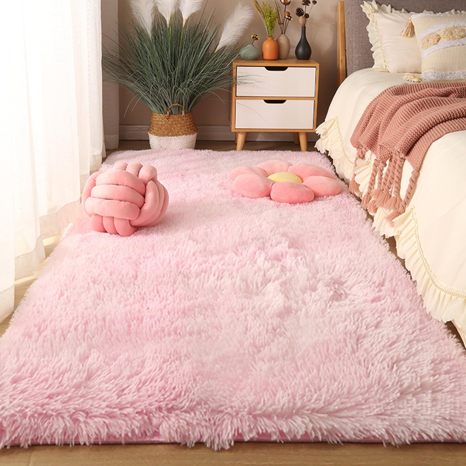 Tapis de chambre moelleux rose pour créer un coin lecture cosy et chaleureux