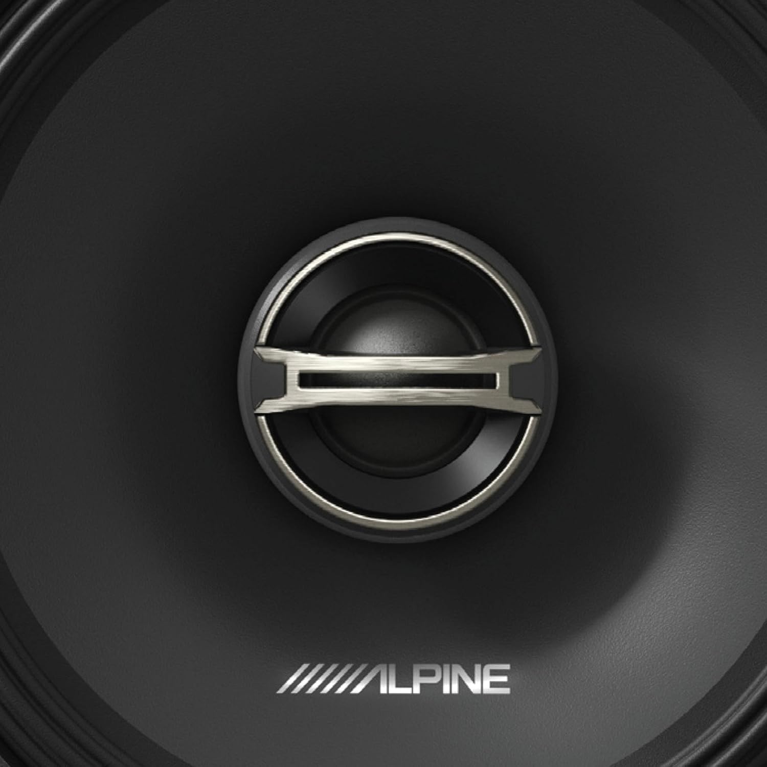 Close-up of the Alpine DM-65-G speaker's center, showing the tweeter and Alpine logo.