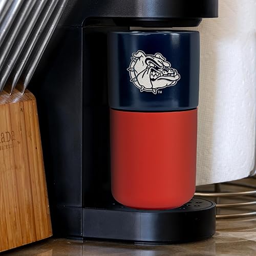 Miniatura 338 de Rico Industries NCAA Miami of Ohio Redhawks - Vaso de cerámica de 16 onzas con agarre de silicona, grabado láser profundo, diseño de color negro