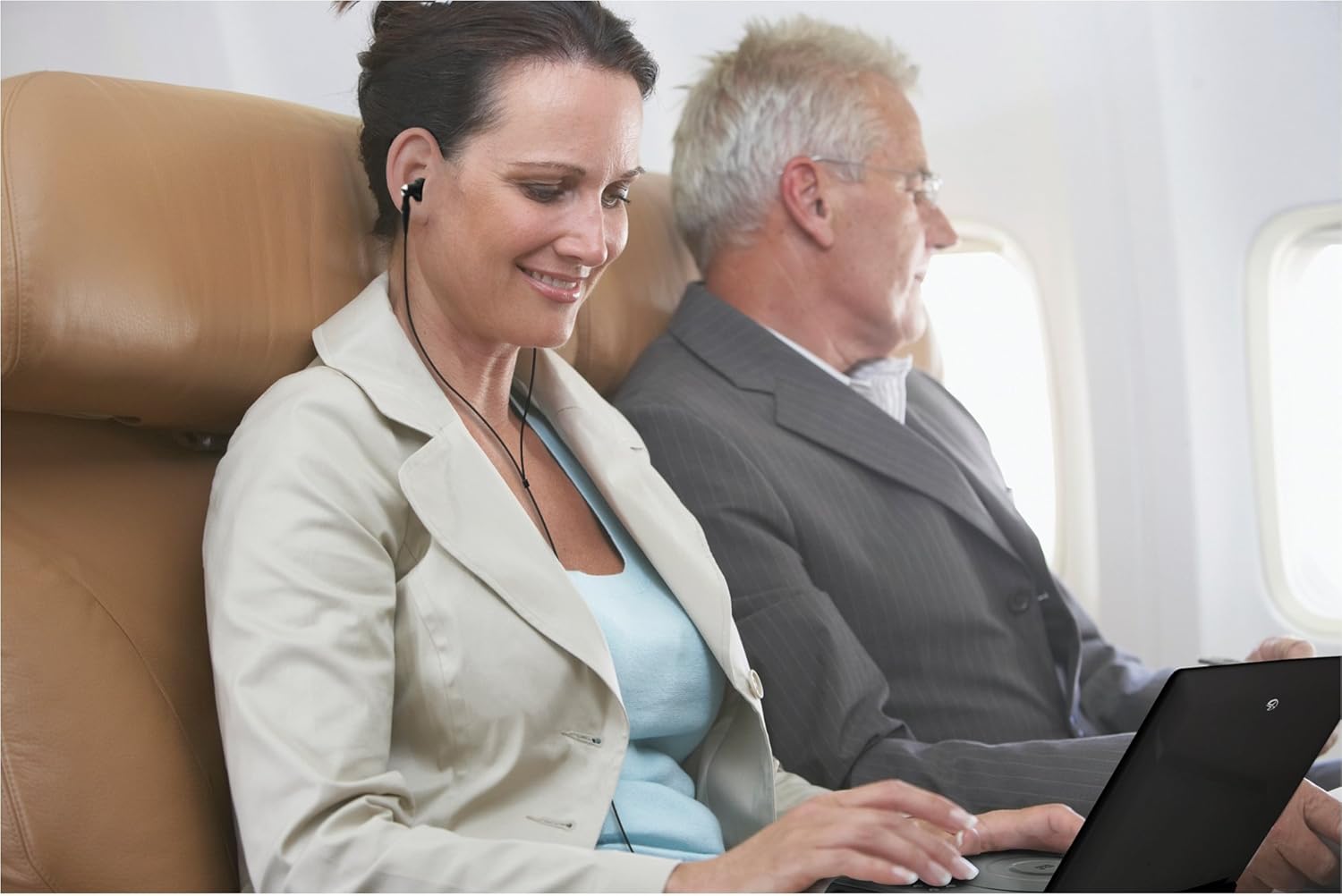 Woman watching DVD player on airplane