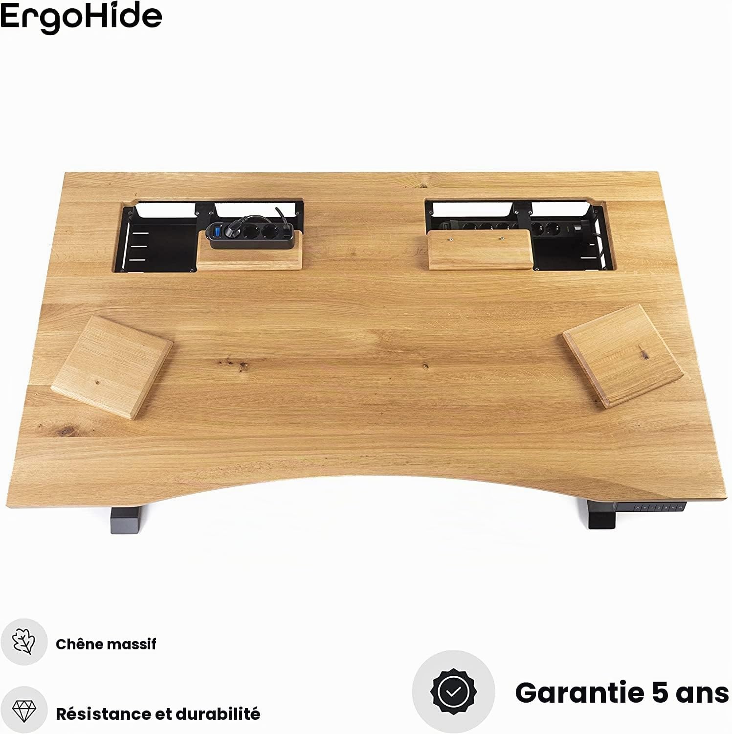 Top-down view of the ErgoHide desk showing open cable management covers and integrated power strips.