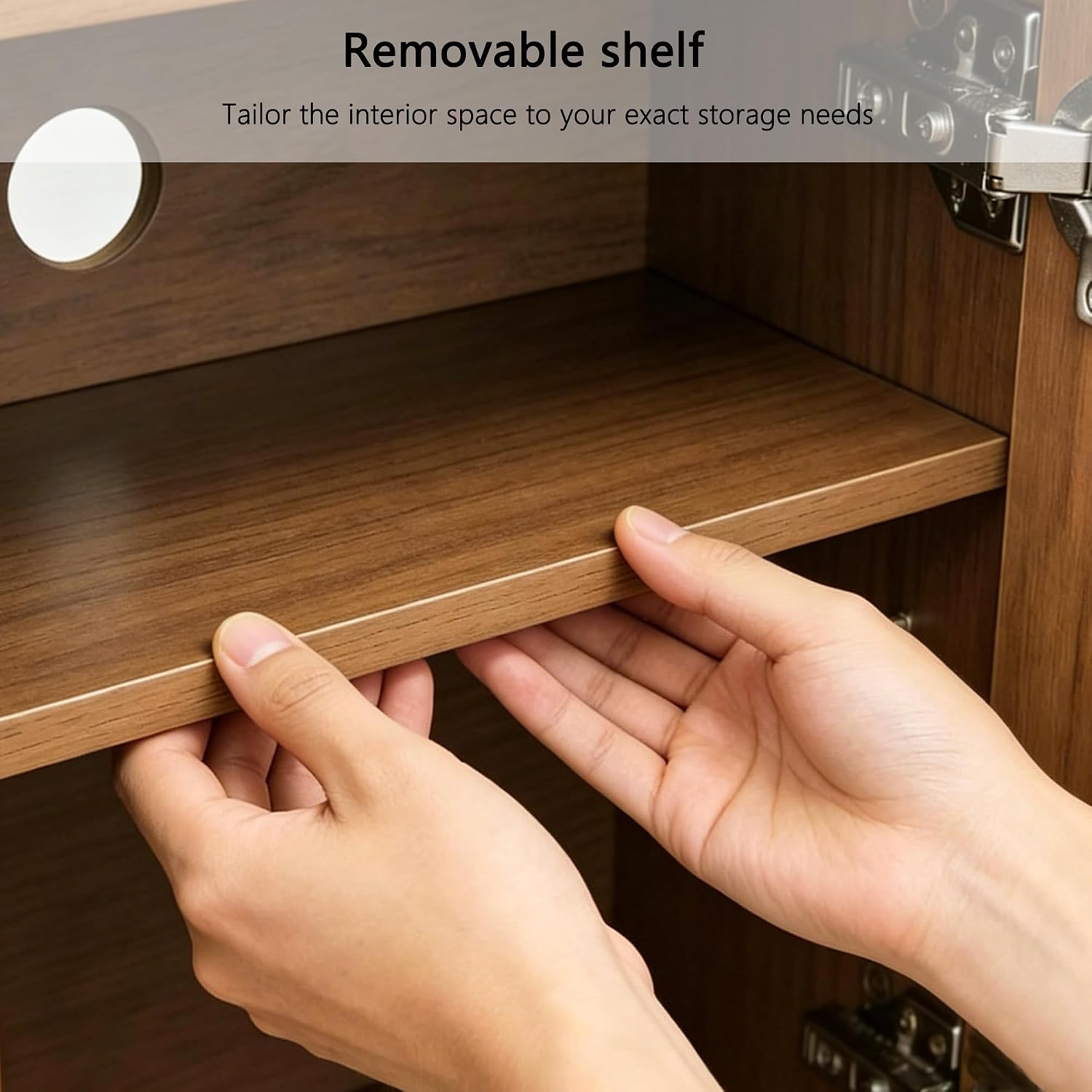 Close-up of hands removing an adjustable shelf from inside a cabinet compartment.