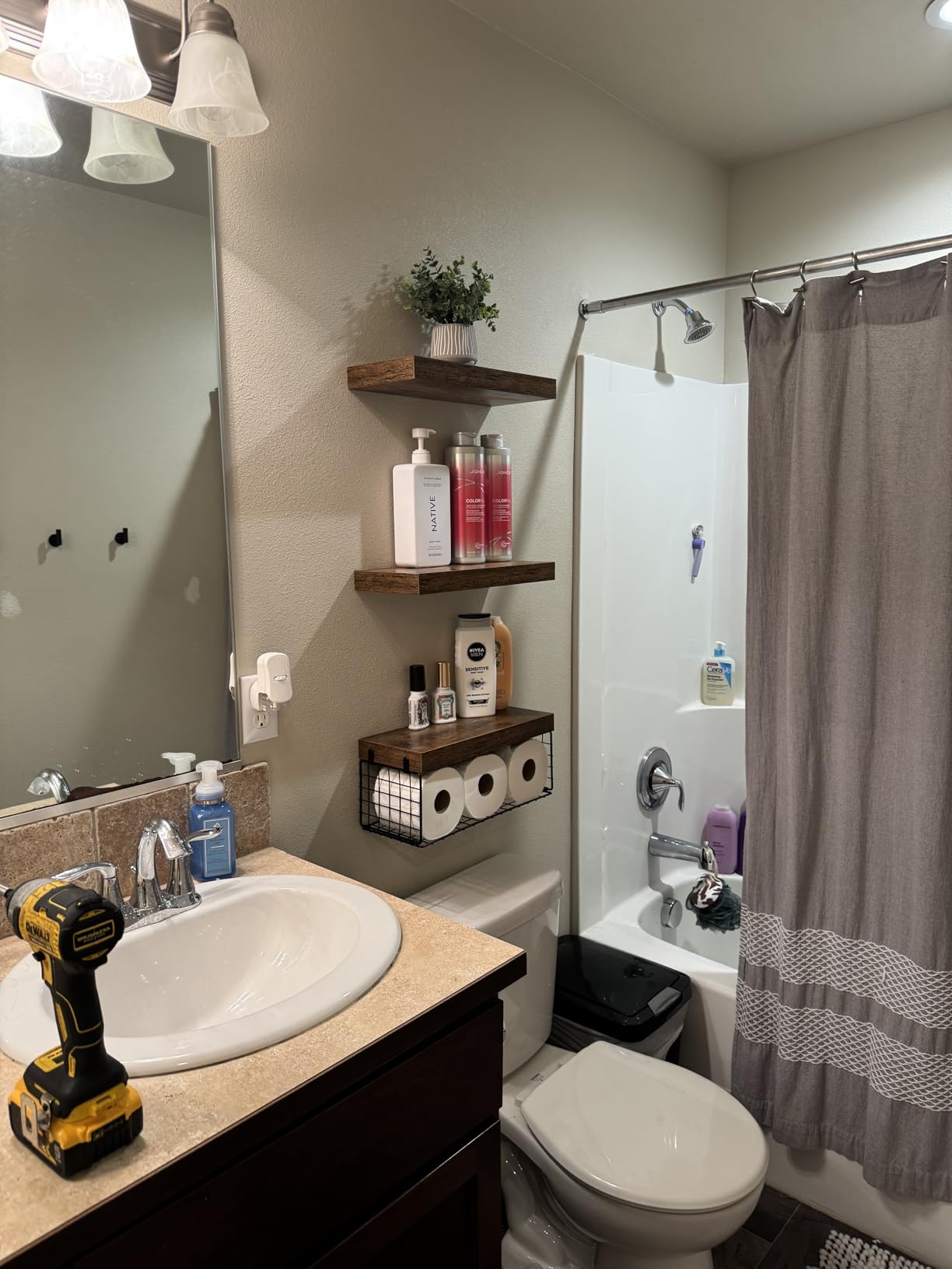 Floating wall shelf in a bathroom styled example