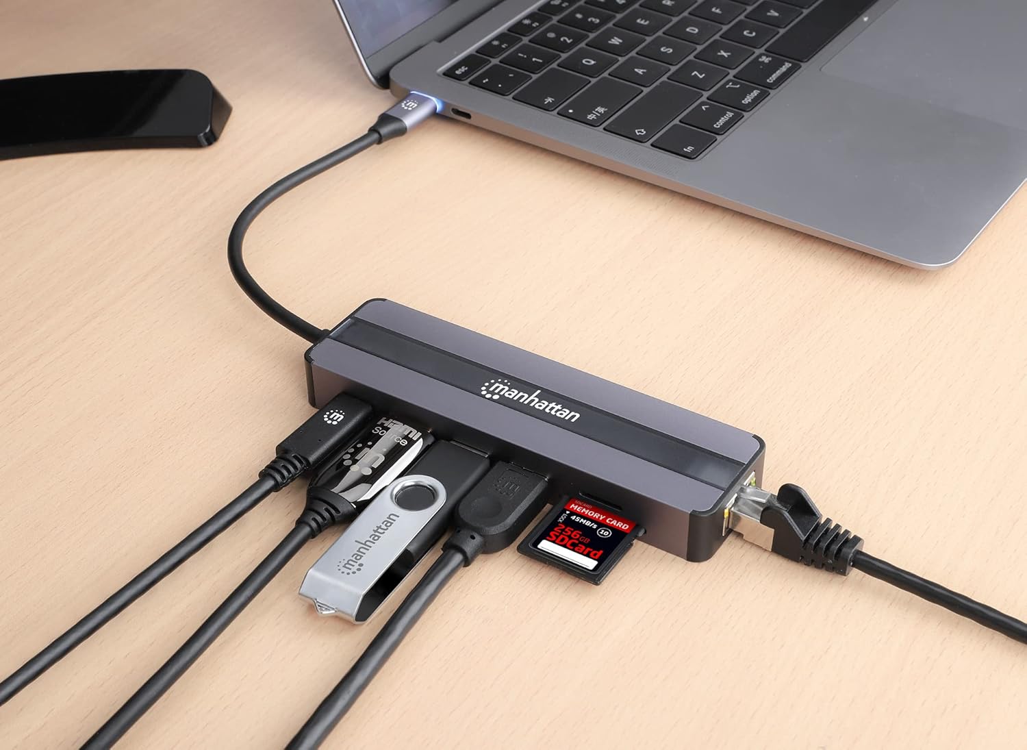 Manhattan USB-C 7-in-1 Docking Station connected to a laptop with multiple peripherals