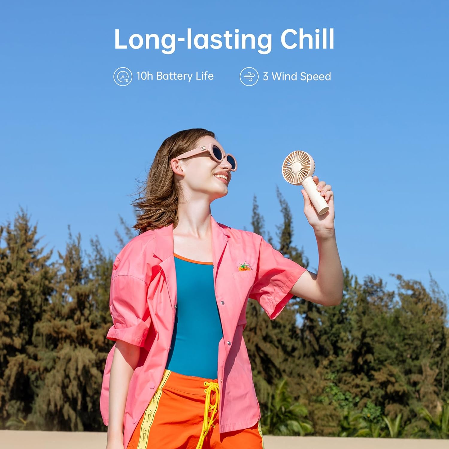 Person using JISULIFE Handheld Portable Mini Fan outdoors.