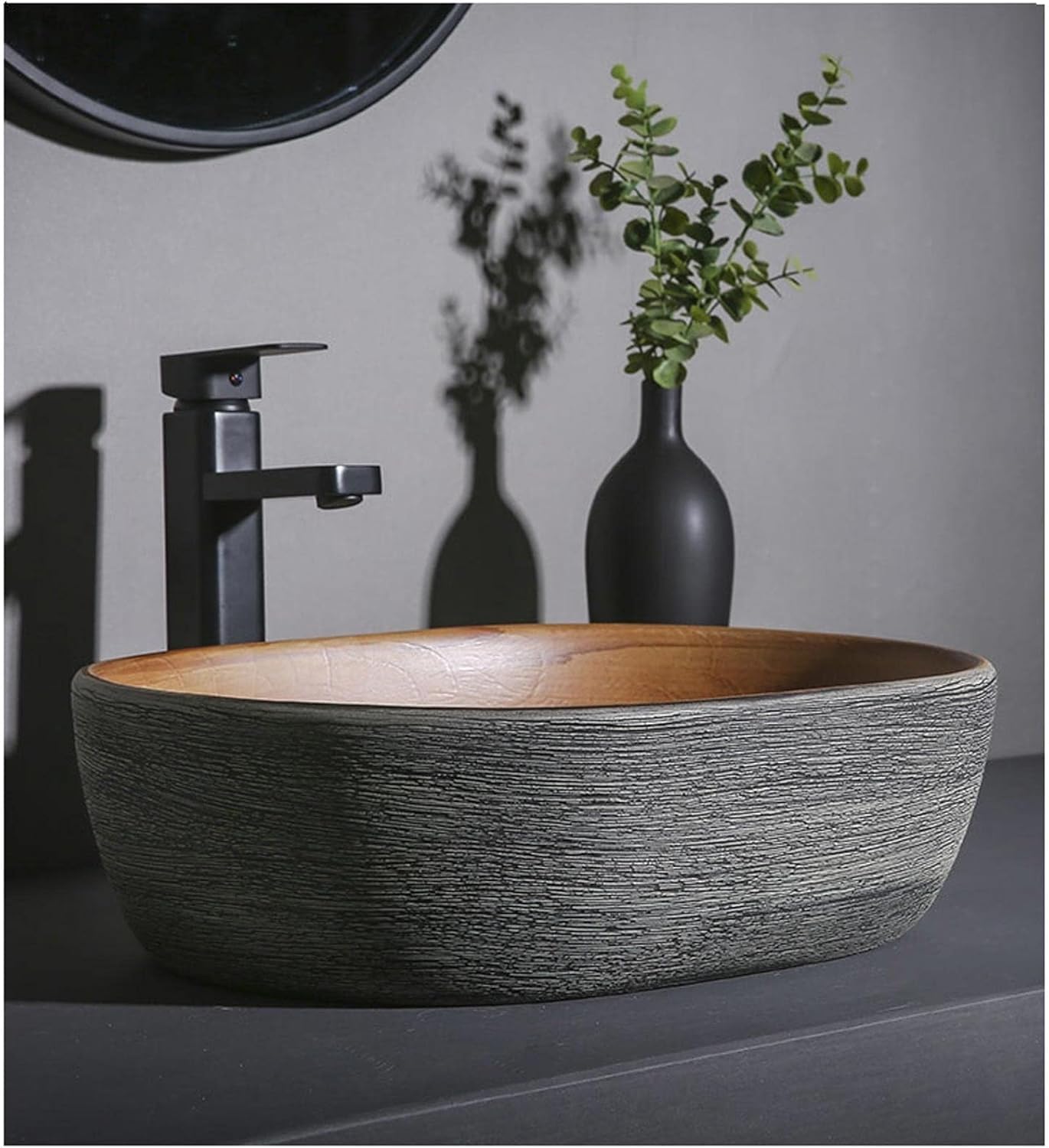 Nowoczesny owalny zlew ceramiczny – umywalka łazienkowa nad blatem, stylowa toaletka na blat do współczesnych przestrzeni i łatwa do czyszczenia