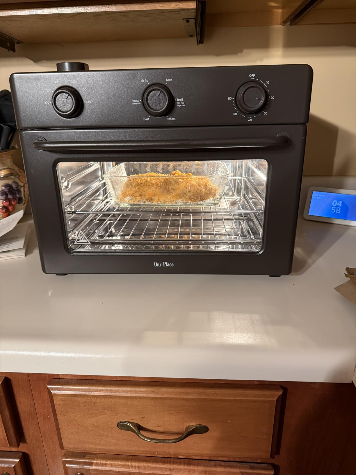 Our Place Wonder Oven | 6-in-1 Stainless Steel Air Fryer Toaster Oven Combo with Basket. Rack. Pan & Tray | Compact 13 QT Countertop Capacity - Toast. Roast. Bake. Reheat. Broil & Steam | Blue Salt photo review